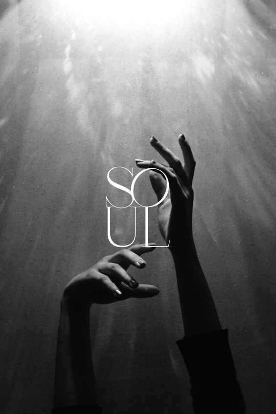 Black and white photograph of expressive hands reaching toward light with Soul typography overlay