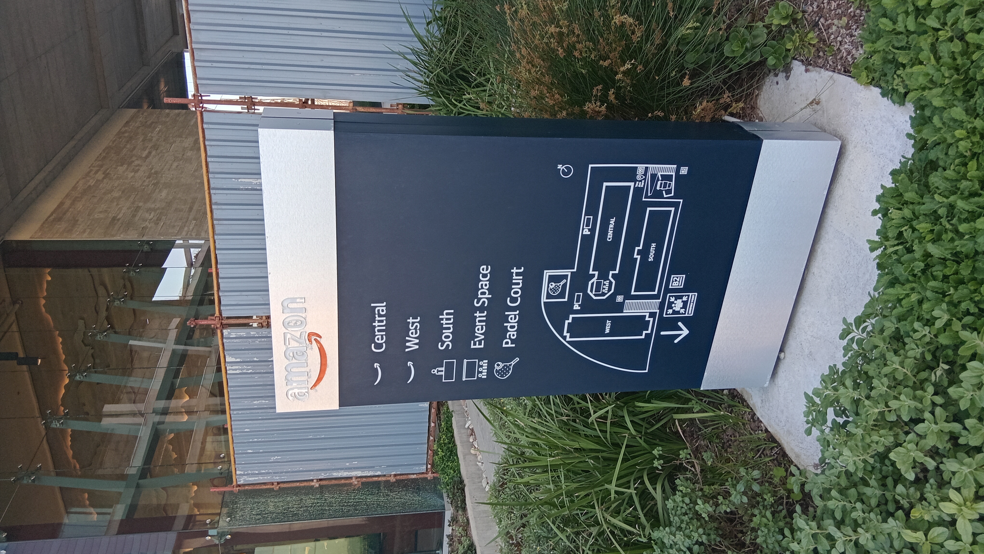Amazon campus directional sign showing Central, West, South, Event Space and Padel Court